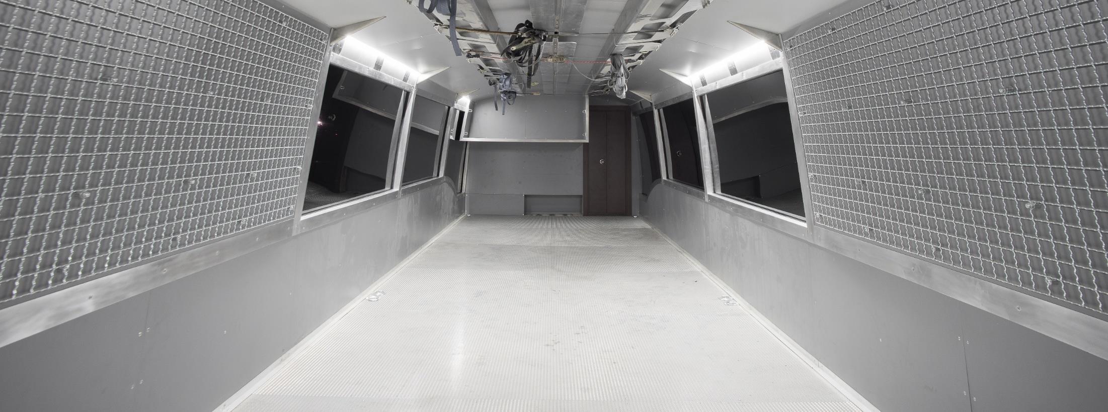 Empty cargo bay inside the team bus lower deck